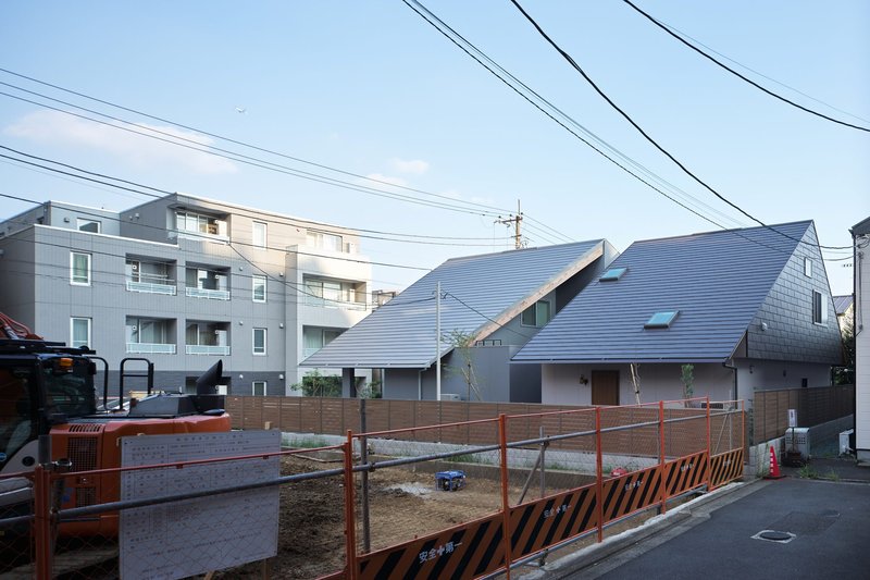 Two Large Roofs Leaning Together