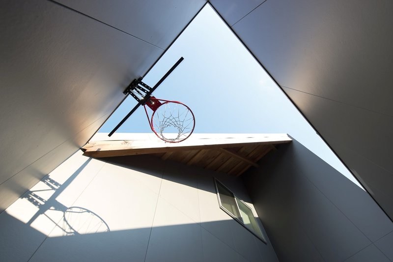 Two Large Roofs Leaning Together